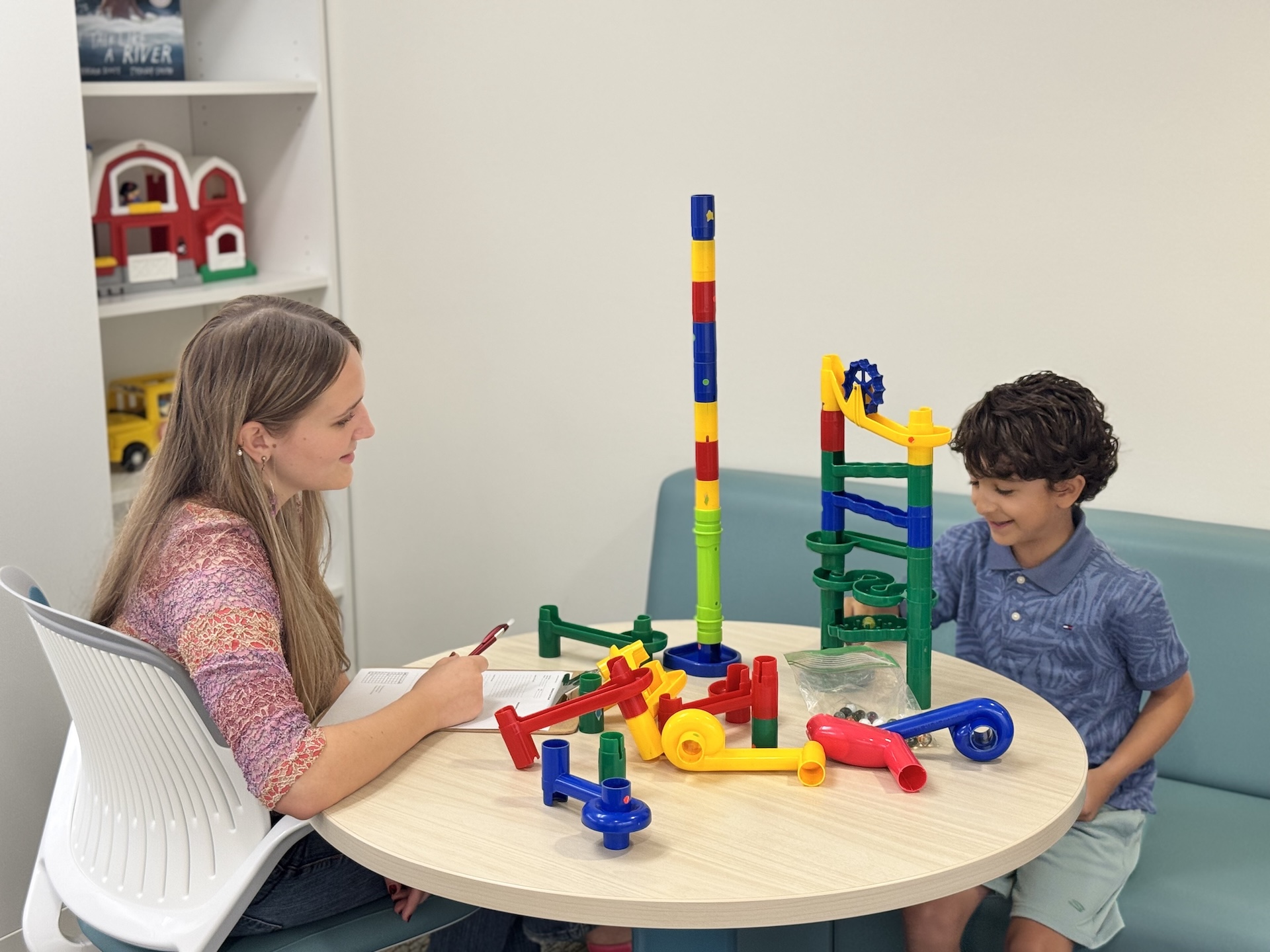 Carissa and Con Playing with Marble run 